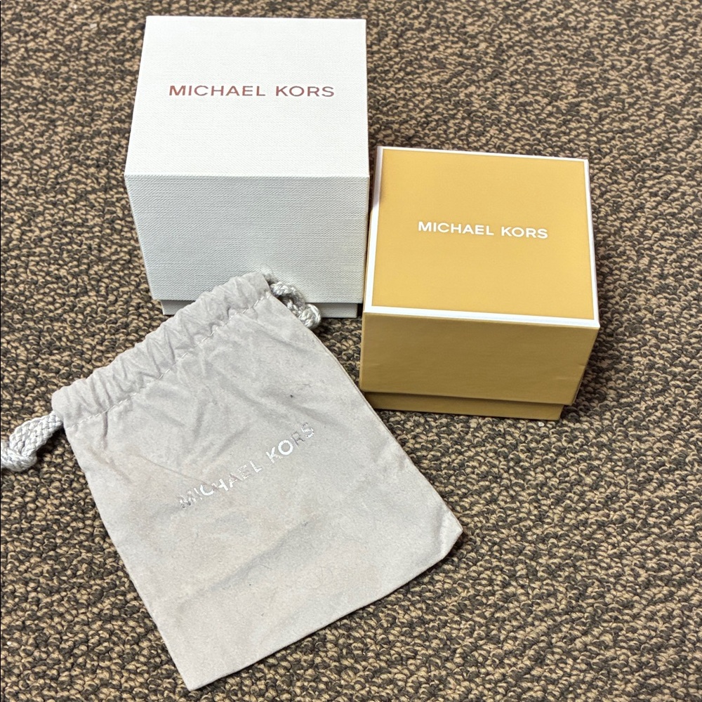 Bundle of Michael Kors watch boxes and pouch